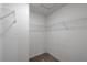A standard walk-in closet with shelving ready for ample storage at 607 Bay Leaf Dr, Poinciana, FL 34759