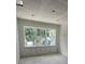 Unfinished bedroom with large windows with nice lighting on a bright day at 1205 Eastin Ave, Orlando, FL 32804