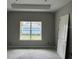Unfinished bedroom with neutral gray walls, a large window, and modern trim at 1205 Eastin Ave, Orlando, FL 32804