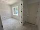 Unfinished room features a window allowing lots of natural light and a door to the rest of the home at 1205 Eastin Ave, Orlando, FL 32804