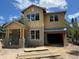 New home exterior with large windows and an attached garage is under construction on a sunny day at 1205 Eastin Ave, Orlando, FL 32804