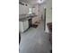 Bright kitchen features granite counters, white cabinetry, and stainless steel appliances at 13378 Sw 89Th Ter, Ocala, FL 34473