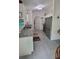 Modern kitchen featuring sleek stainless steel appliances, gray tile and granite countertops at 13378 Sw 89Th Ter, Ocala, FL 34473