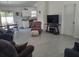 A well lit living room open to the kitchen and dining area at 13378 Sw 89Th Ter, Ocala, FL 34473