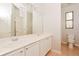 Bathroom features double sinks, large mirror, and a private toilet area at 1405 Harbor Ridge Dr, Kissimmee, FL 34759