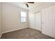 Carpeted bedroom featuring a window with blinds and a closet with sliding doors at 1405 Harbor Ridge Dr, Kissimmee, FL 34759