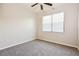 Comfortable bedroom with soft carpet, bright window, and a ceiling fan at 1405 Harbor Ridge Dr, Kissimmee, FL 34759