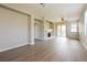 Spacious living room with wood flooring, fireplace, ceiling fan, and sliding glass doors to the lanai at 1405 Harbor Ridge Dr, Kissimmee, FL 34759