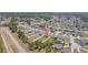 Aerial perspective of a house in a suburban development, complemented by lush greenery, offering a serene living environment at 329 W Aster Ct, Poinciana, FL 34759