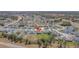 Aerial view of a residential property, revealing its neighborhood in a suburban setting with a highway nearby at 329 W Aster Ct, Poinciana, FL 34759