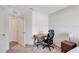 Simple bedroom with a wooden desk, office chair, and minimalist decor providing a quiet space at 329 W Aster Ct, Poinciana, FL 34759