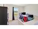 Cozy bedroom featuring a work desk, and a window with scenic outdoor views at 329 W Aster Ct, Poinciana, FL 34759
