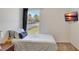 Relaxing bedroom features a twin bed, and TV, creating a welcoming and comfortable atmosphere at 329 W Aster Ct, Poinciana, FL 34759