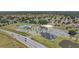 Community center featuring swimming pool, basketball court, playground, and parking at 329 W Aster Ct, Poinciana, FL 34759