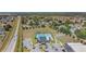 Overhead shot of neighborhood pool and amenity center, featuring basketball court, pool, and well maintained grounds at 329 W Aster Ct, Poinciana, FL 34759