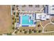 Aerial view of community swimming pool with lane markers, area, and a bath house at 329 W Aster Ct, Poinciana, FL 34759