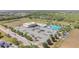 Aerial view of community pool with a ' area, playground, basketball court and ample parking at 329 W Aster Ct, Poinciana, FL 34759
