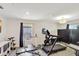 Home gym featuring exercise equipment and wood floors at 329 W Aster Ct, Poinciana, FL 34759