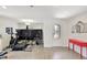 Home gym with exercise equipment, neutral walls, and a console table with a red top at 329 W Aster Ct, Poinciana, FL 34759