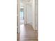 Hallway with hardwood floors showing bedrooms at the end of the hallway at 329 W Aster Ct, Poinciana, FL 34759
