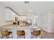 Bright kitchen with granite countertops and stainless steel appliances at 329 W Aster Ct, Poinciana, FL 34759