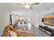 Open-concept living room with a view of the modern kitchen and stainless steel appliances at 329 W Aster Ct, Poinciana, FL 34759