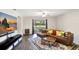 Bright open-concept living area featuring a large sliding glass door to the backyard at 329 W Aster Ct, Poinciana, FL 34759