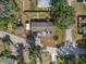 An aerial shot of the property's backyard with a shed and grassy lawn at 4795 Myrtle View W Dr, Mulberry, FL 33860