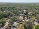 An aerial neighborhood view with lush, mature trees at 4795 Myrtle View W Dr, Mulberry, FL 33860