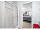 Bathroom view features glass door shower to the left and access to primary bedroom on the right at 4795 Myrtle View W Dr, Mulberry, FL 33860