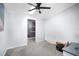 This simple bedroom offers bright, neutral walls, access to other rooms, and soft carpet at 4795 Myrtle View W Dr, Mulberry, FL 33860