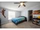 Bedroom featuring a ceiling fan, closet, and a bed with a blue patterned quilt at 4795 Myrtle View W Dr, Mulberry, FL 33860