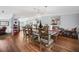 Spacious dining room featuring a rustic wood table and chairs with an open view to the kitchen at 4795 Myrtle View W Dr, Mulberry, FL 33860