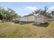 Exterior view of the home and detached garage at 4795 Myrtle View W Dr, Mulberry, FL 33860