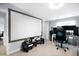 Gaming room with large screen for movies, gaming chairs and multiple monitors at 4795 Myrtle View W Dr, Mulberry, FL 33860