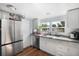 This well-lit kitchen features stainless steel appliances, a pantry, and generous cabinet space at 4795 Myrtle View W Dr, Mulberry, FL 33860
