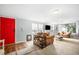 Cozy living room featuring comfortable leather furniture, a charming fireplace, and bright natural light at 4795 Myrtle View W Dr, Mulberry, FL 33860