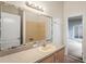Bathroom with a vanity, mirror and a shower, creating a functional space at 541 Willet Cir, Auburndale, FL 33823