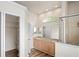 Bathroom featuring a double vanity, shower, and a walk-in closet at 541 Willet Cir, Auburndale, FL 33823
