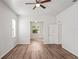 Bright bedroom with wood floors and ample natural light, creating a welcoming atmosphere at 541 Willet Cir, Auburndale, FL 33823