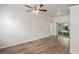 Spacious living room with light wood-look flooring and sliding glass doors at 541 Willet Cir, Auburndale, FL 33823