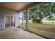 Enjoy views of a lush yard and mature tree from this screened patio at 541 Willet Cir, Auburndale, FL 33823