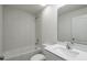 Bathroom featuring tub, shower, and single sink vanity at 603 Bay Leaf Dr, Poinciana, FL 34759