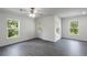 Living room featuring gray wood floors, white walls, recessed lighting, a ceiling fan, and natural light at 603 Bay Leaf Dr, Poinciana, FL 34759