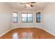 Sun-filled bedroom offering laminate floors, a neutral paint palette, and three sun-filled windows at 505 Millifiora Ln, Kissimmee, FL 34759
