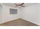 Comfortable bedroom boasts neutral carpet and a stylish ceiling fan fixture at 803 Mccranie Rd, Lakeland, FL 33809