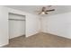 Bedroom featuring carpet, closet and ceiling fan for optimal comfort at 803 Mccranie Rd, Lakeland, FL 33809