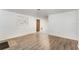 Neutral living room featuring wood-look flooring and a decorative inset wall shelf at 803 Mccranie Rd, Lakeland, FL 33809