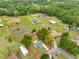 Expansive aerial view of the charming single-Gathering home with a spacious yard and mature trees at 9210 Lehall W Sq, Lakeland, FL 33810