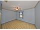 Cozy bedroom with ceiling fan and window allowing natural light at 9210 Lehall W Sq, Lakeland, FL 33810
